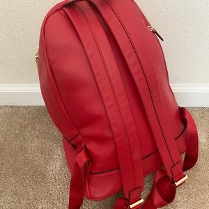Red Michael Kors backpack purse